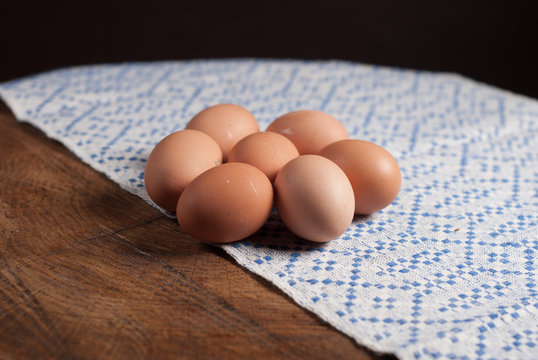 eggs and towel with a blue pattern