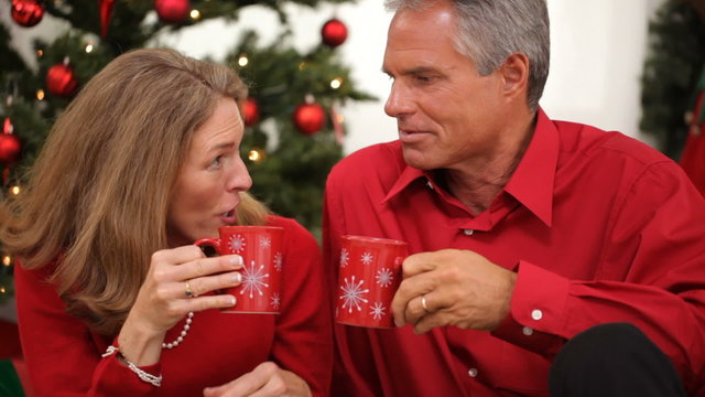 Senior couple drinking from mugs