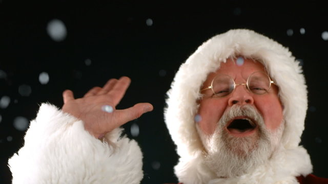 Santa Claus waving and laughing