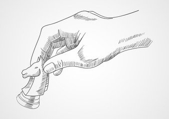 Human hand holding chess knight piece © rudall30