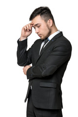 Young man in business suit, thinking about something, isolated on a white background