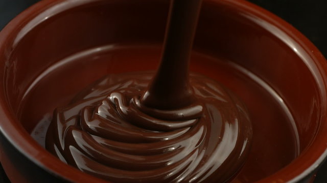 Melted Chocolate pouring in pot