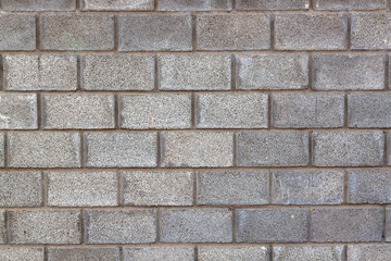Gray concrete blocks wall, background texture