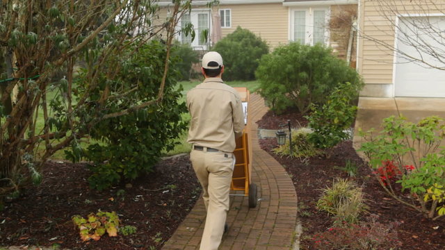Delivery man delivers packages to home