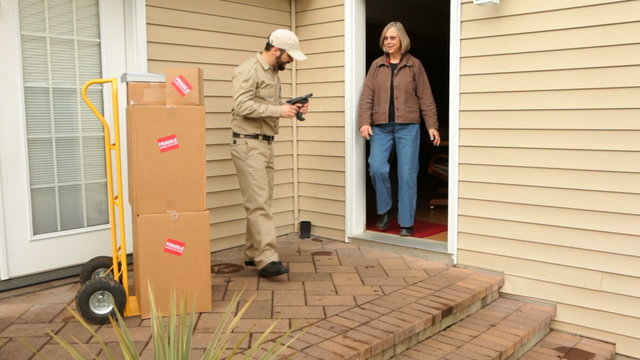 Man delivers packages to woman at home