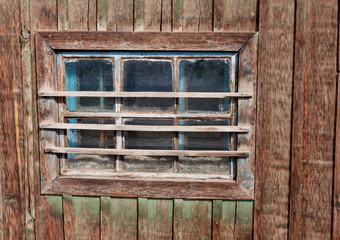 Wooden vintage  window on a wooden wall