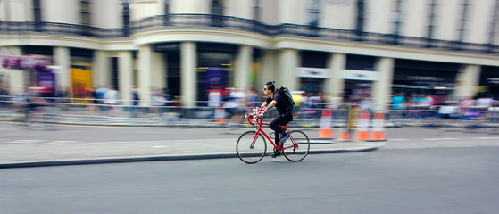Cyclist Riding Bike Fast Through City. Speed Blur © jgolby