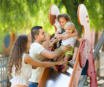 Family Of Four At Playground