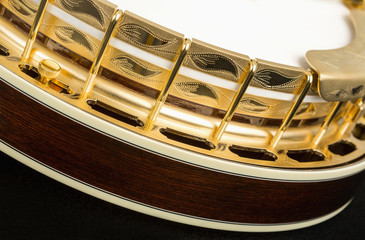 Metalic banjo isolated on black background