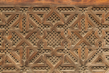carved wood decoration on a wall in Fes