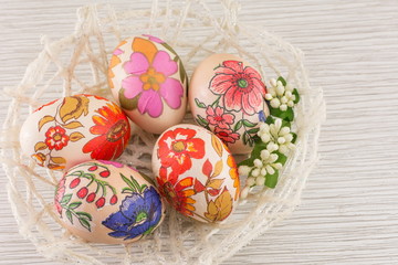 Obraz na płótnie Canvas Decorated Easter eggs in a basket