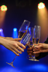 People with champagne in a bar or casino having lots of fun