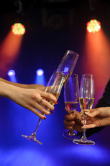 People with champagne in a bar or casino having lots of fun