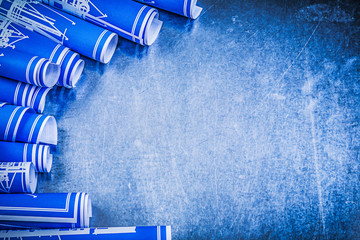 Collection of blue construction plans on metallic background mai