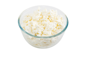 Cottage cheese in glass bowl on a light background