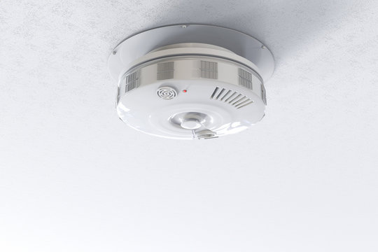 smoke detector on ceiling with blank space