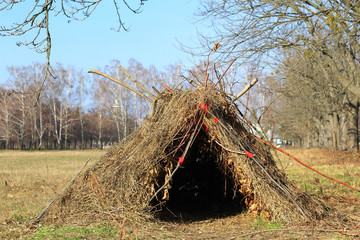hut of branches, shelter, hovel out in the park