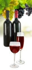 Image of glasses and bottles of wine and grape close-up