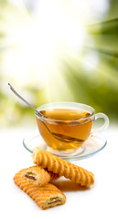 image of cup of tea and cookies closeup