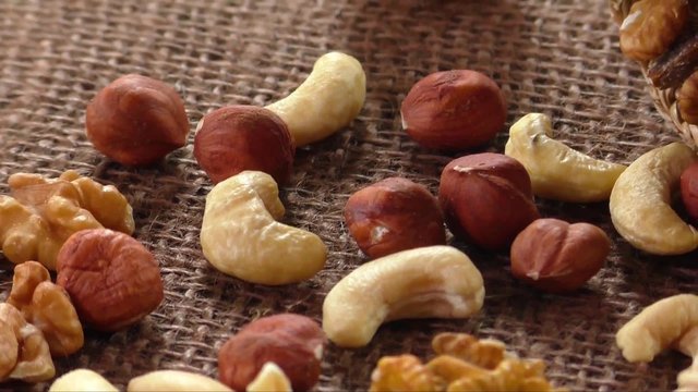 Almonds, cashew, walnuts and hazelnuts lying on burlap 
