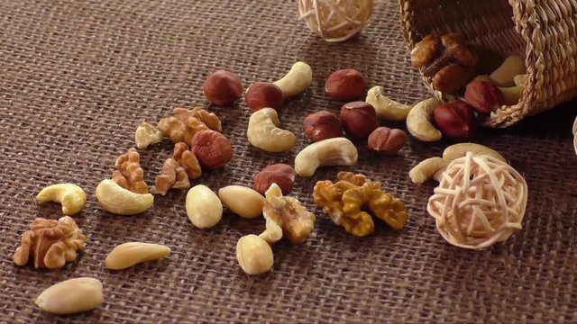 Almonds, cashew, walnuts and hazelnuts lying on burlap 
