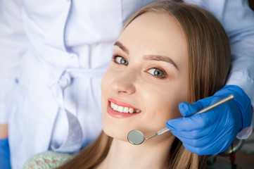 Dentist examining a patient's teeth