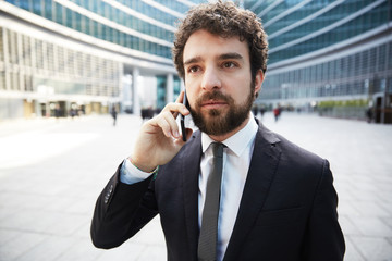 businessman talking to mobile