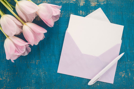 Flowers, envelope and pen 
