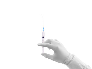 Doctor hand in white glove hold syringe with preparation jet.