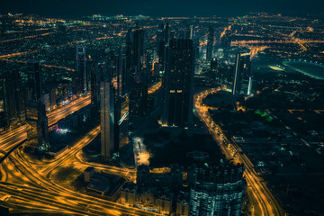 Dubai downtown night scene with city lights