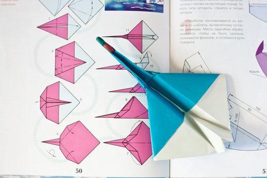Blue paper airplane