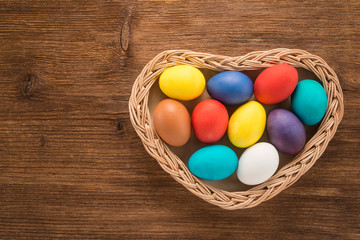 Obraz na płótnie Canvas Easter eggs on wooden background 