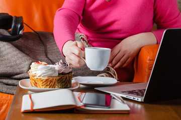Woman drink tea and eat sweets
