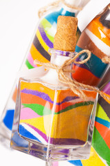 decorative bottles with colorful sand