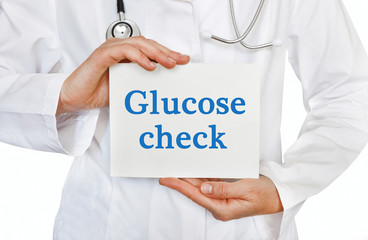 Doctor holding a card with Glucose Check, Medical concept