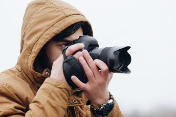 Photographer take picture in open space at river