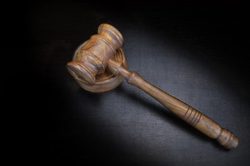 Judges Or Auctioneer Gavel On Black Wood Grunge Background