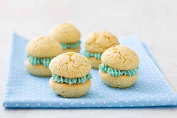 Vanilla whoopie pies with turquoise buttercream filling