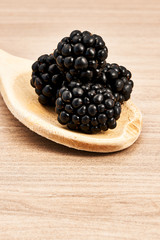 blackberries on a wooden spoon
