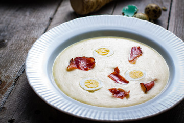 Horseradish cream soup with quail egg and black forest ham.