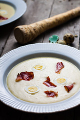 Horseradish cream soup with quail egg and black forest ham.