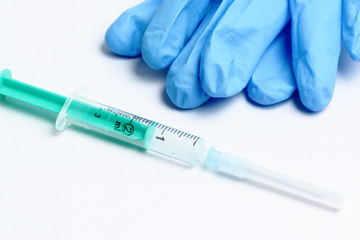 Fototapeta premium Medical syringe and gloves