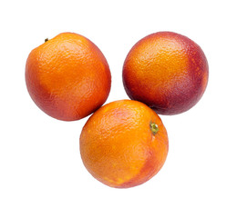 Three colorful sicilian oranges isolated on white
