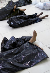 the broken dummies in black bags on a floor