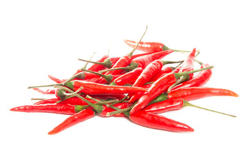 Pods of hot red pepper on a white background