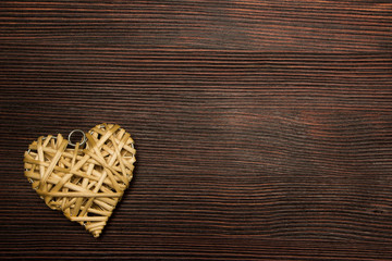 straw heart on a wooden background