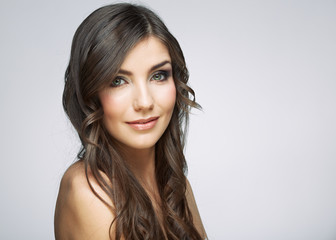 Beauty woman face portrait. Isolated on gray background