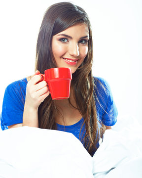 Smiling woman hold red coffee cup.