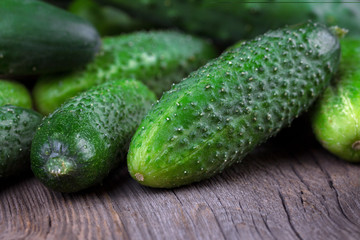 Cucumbers on a wooden background.