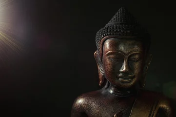 Poster Boeddha Wooden bronze buddha on black background